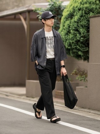 Flip Flops Outfits For Men: Seriously stylish yet practical, this look combines a charcoal short sleeve shirt and black chinos. Feel uninspired with this look? Enter a pair of flip flops to jazz things up.
