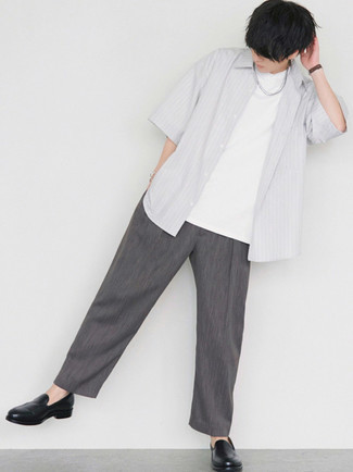 Grey Vertical Striped Short Sleeve Shirt with Charcoal Chinos Outfits: This relaxed casual combo of a grey vertical striped short sleeve shirt and charcoal chinos will catch attention wherever you go. A pair of black leather loafers will polish up any outfit.