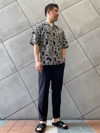 Black and White Floral Short Sleeve Shirt Outfits For Men: For a casually cool outfit, choose a black and white floral short sleeve shirt and black chinos — these two pieces go nicely together. Complement this look with black canvas sandals to make a standard outfit feel suddenly fresh.