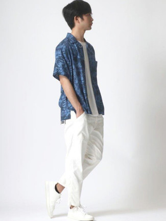 Navy Floral Short Sleeve Shirt Outfits For Men: To put together a casual ensemble with a clear fashion twist, consider pairing a navy floral short sleeve shirt with white chinos. Throw white canvas low top sneakers in the mix and ta-da: this outfit is complete.