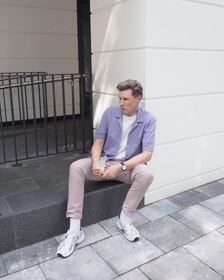 Silver Athletic Shoes Outfits For Men: This casual combination of a light violet short sleeve shirt and khaki chinos is a safe option when you need to look sharp in a flash. If you want to immediately dial down your getup with shoes, add silver athletic shoes to the equation.