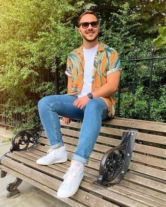 White Leather High Top Sneakers Outfits For Men: Perfect casual in an orange print short sleeve shirt and blue jeans. Does this ensemble feel too dressy? Let white leather high top sneakers change things up a bit.