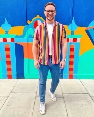 Multi colored Vertical Striped Short Sleeve Shirt Outfits For Men: A multi colored vertical striped short sleeve shirt and blue jeans have become must-have off-duty essentials for most men. Serve a little mix-and-match magic by sporting white canvas high top sneakers.