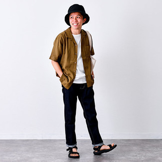 Tobacco Short Sleeve Shirt Outfits For Men: A tobacco short sleeve shirt and navy jeans are a good ensemble worth having in your casual lineup. Enter a pair of black canvas sandals into the equation to bring a sense of stylish effortlessness to this look.