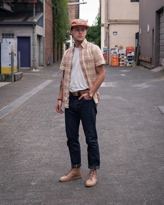 Tan Leather High Top Sneakers Outfits For Men: This relaxed pairing of a pink gingham short sleeve shirt and navy jeans is a tested option when you need to look nice in a flash. Complement this look with a pair of tan leather high top sneakers to keep the outfit fresh.