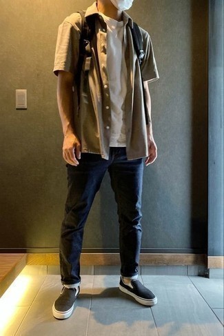 Black Canvas Slip-on Sneakers Outfits For Men: If you feel more confident in functional clothes, you'll like this relaxed casual pairing of a tan short sleeve shirt and navy jeans. A pair of black canvas slip-on sneakers can integrate effortlessly within a myriad of combinations.