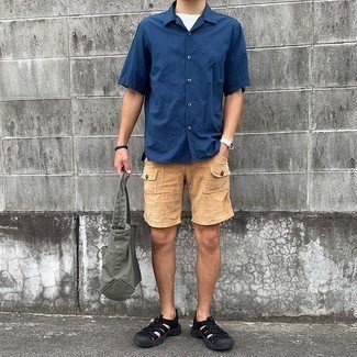 Tan Shorts Outfits For Men: This combo of a navy short sleeve shirt and tan shorts is very easy to throw together and so comfortable to rock a version of over the course of the day as well! Why not complement your getup with black canvas sandals for a laid-back vibe?