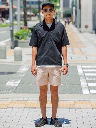 Black Leather Sandals Outfits For Men: Rock a black short sleeve shirt with beige shorts for a practical getup that's also pieced together nicely. Infuse a more relaxed spin into your getup with a pair of black leather sandals.