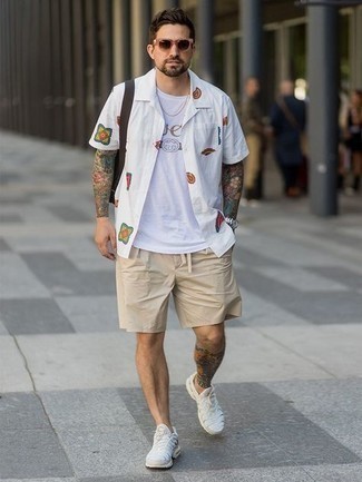 Beige Shorts Outfits For Men: Pairing a white print short sleeve shirt with beige shorts is a good choice for a casual yet stylish ensemble. If you need to immediately dress down your outfit with footwear, why not complete this outfit with a pair of white athletic shoes?