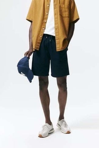 Navy Shorts Outfits For Men: If you wish take your off-duty fashion game to a new level, choose a tobacco short sleeve shirt and navy shorts. Add a more relaxed twist to your getup by finishing off with grey athletic shoes.