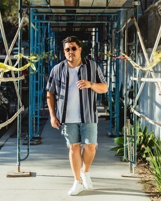 Light Blue Denim Shorts Outfits For Men: Pair a navy and white vertical striped short sleeve shirt with light blue denim shorts to get a city casual and stylish ensemble. Add white canvas low top sneakers to the equation and the whole ensemble will come together.