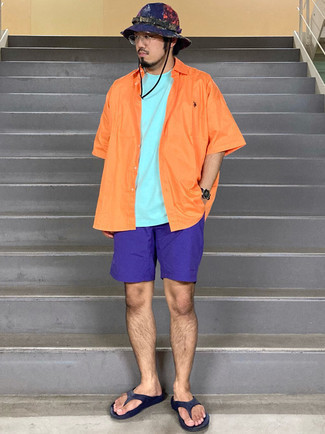 Flip Flops Outfits For Men: If you're on the lookout for a street style and at the same time sharp ensemble, team an orange short sleeve shirt with violet sports shorts. Finishing off with flip flops is a surefire way to infuse a dash of stylish effortlessness into your ensemble.
