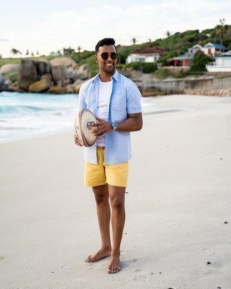 Swim Shorts Outfits: A light blue linen short sleeve shirt and swim shorts are the kind of off-duty must-haves that you can style a hundred of ways.