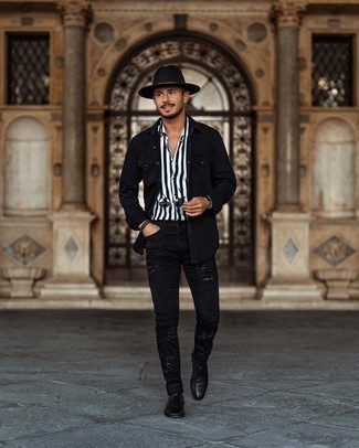 Black Denim Shirt Outfits For Men: This laid-back pairing of a black denim shirt and black ripped skinny jeans is a goofproof option when you need to look nice in a flash. Wondering how to complement your ensemble? Wear a pair of black leather chelsea boots to dial it up a notch.