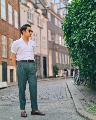Teal Dress Pants Outfits For Men: A white short sleeve shirt and teal dress pants are surely worth being on your list of wardrobe essentials. Complete this look with dark brown leather loafers to easily boost the fashion factor of your outfit.
