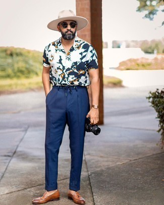 Brown Leather Loafers Outfits For Men: If the occasion calls for a casually sleek look, try teaming a white floral short sleeve shirt with navy dress pants. Add a pair of brown leather loafers to the equation to instantly turn up the wow factor of this ensemble.