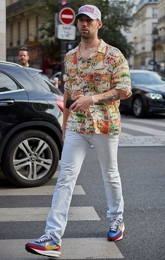 Multi colored Print Short Sleeve Shirt Outfits For Men: For something more on the cool and laid-back end, marry a multi colored print short sleeve shirt with white jeans. For a more casual touch, complement your ensemble with multi colored athletic shoes.