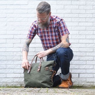 Olive Canvas Tote Bag Outfits For Men: A white and red and navy plaid short sleeve shirt and an olive canvas tote bag are a good getup to add to your casual styling routine. Tobacco leather brogue boots will easily lift up even your most comfortable clothes.