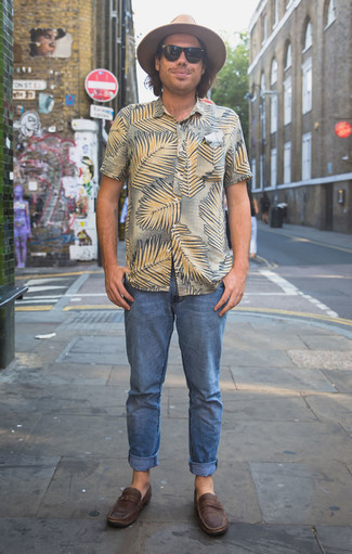 Tan Short Sleeve Shirt Outfits For Men: A tan short sleeve shirt and blue jeans are among the crucial items in any gent's well-coordinated casual wardrobe. If you need to instantly bump up this look with one single piece, make dark brown leather loafers your footwear choice.