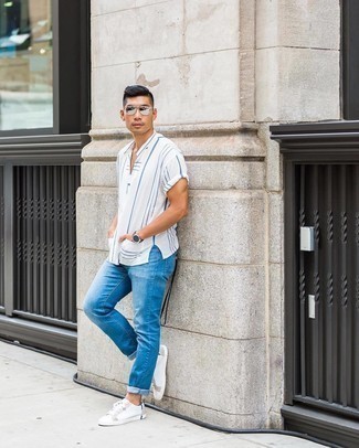 Silver Sunglasses Outfits For Men: We all seek functionality when it comes to styling, and this urban combination of a white and blue vertical striped short sleeve shirt and silver sunglasses is a practical illustration of that. Smarten up your ensemble with the help of a pair of white canvas low top sneakers.