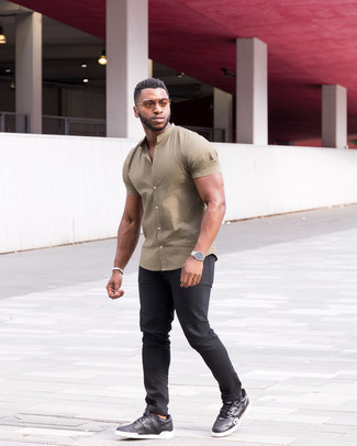 Beige Short Sleeve Shirt Outfits For Men: A beige short sleeve shirt and black jeans teamed together are a perfect match. If you're clueless about how to finish, complete this look with a pair of black and white print leather low top sneakers.