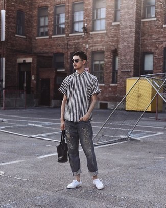 Charcoal Short Sleeve Shirt Outfits For Men: A charcoal short sleeve shirt and charcoal print jeans are a cool look that will easily carry you throughout the day. Complete this outfit with a pair of white canvas low top sneakers and you're all set looking incredible.