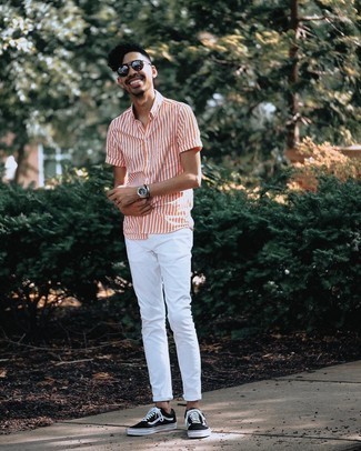 Black and White Canvas Low Top Sneakers Outfits For Men: Wear an orange vertical striped short sleeve shirt with white jeans for an off-duty ensemble with a modern take. Black and white canvas low top sneakers are a safe footwear style that's full of personality.