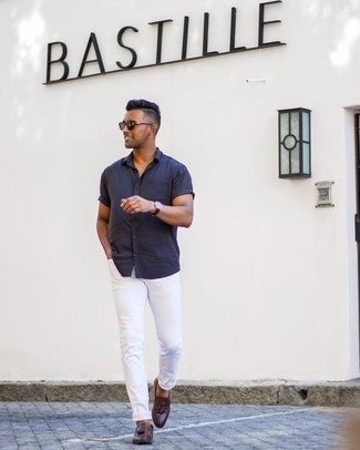 Navy Short Sleeve Shirt Outfits For Men: Infuse variation into your daily off-duty repertoire with a navy short sleeve shirt and white jeans. If you wish to instantly up the style ante of this look with footwear, complete your outfit with a pair of dark brown leather tassel loafers.
