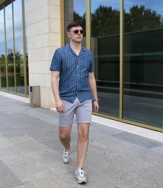 Men's Navy and White Vertical Striped Short Sleeve Shirt, Grey Shorts, Grey Athletic Shoes, Dark Brown Sunglasses