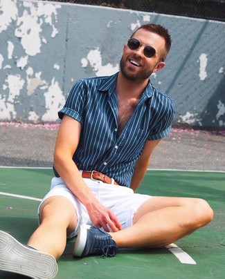 Blue Vertical Striped Short Sleeve Shirt Outfits For Men: A blue vertical striped short sleeve shirt and white shorts are great menswear pieces to have in your casual box. Give an easy-going touch to this outfit by wearing navy suede high top sneakers.