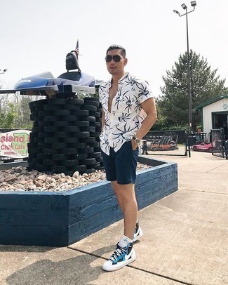 Blue Shorts Outfits For Men: This outfit with a white and navy print short sleeve shirt and blue shorts isn't hard to pull together and is easy to adapt. For footwear, you could stick to a more casual route with white and blue leather high top sneakers.