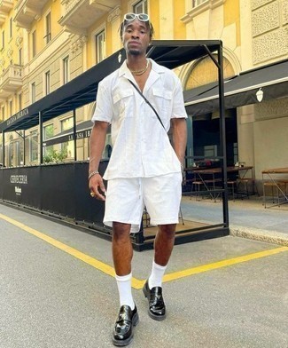 White Shorts Outfits For Men: Consider wearing a white short sleeve shirt and white shorts for a laid-back and fashionable getup. Avoid looking too casual by rounding off with a pair of black chunky leather loafers.