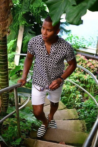 White and Black Print Short Sleeve Shirt Outfits For Men: This pairing of a white and black print short sleeve shirt and white denim shorts combines comfort and confidence and helps keep it low profile yet trendy. For something more on the sophisticated end to complement this outfit, complete your look with black and white canvas loafers.