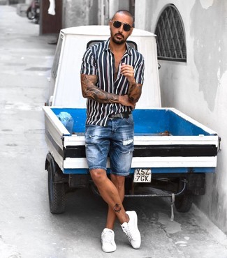Men's Navy and White Vertical Striped Short Sleeve Shirt, Blue Ripped Denim Shorts, White Leather Low Top Sneakers, Black Leather Belt