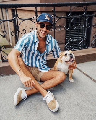 Men's White and Blue Vertical Striped Short Sleeve Shirt, Tan Shorts, Tan Suede Low Top Sneakers, Navy Print Baseball Cap