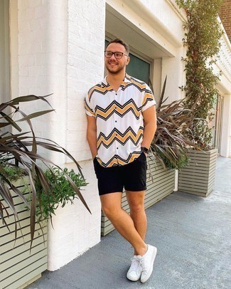 White Chevron Short Sleeve Shirt Outfits For Men: For a cool and casual ensemble, try pairing a white chevron short sleeve shirt with black shorts — these two pieces fit nicely together. Complement your ensemble with a pair of white leather low top sneakers to pull your full ensemble together.