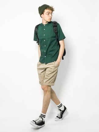 Dark Green Beanie Outfits For Men In Their Teens: For something on the casual and cool end, rock a dark green short sleeve shirt with a dark green beanie. Complete your look with a pair of black and white canvas low top sneakers to take things up a notch. Men wondering how to dress fashionably and look good as you are making it through your teen years, you have your answer.