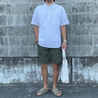 1200+ Relaxed Outfits For Men: Pair a white short sleeve shirt with dark green shorts for standout menswear style. Finishing off with a pair of beige suede sandals is a surefire way to inject a bit more edginess into your ensemble.