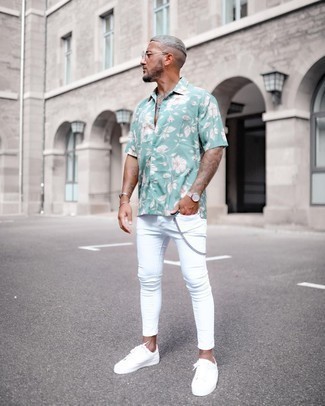 Charcoal Leather Watch Outfits For Men: For an ensemble that's pared-down but can be styled in a ton of different ways, wear a mint floral short sleeve shirt with a charcoal leather watch. Let your sartorial sensibilities really shine by finishing your ensemble with white canvas low top sneakers.