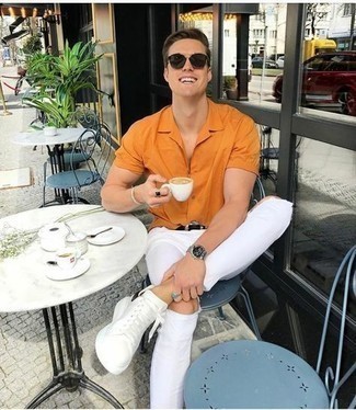 Men's Orange Short Sleeve Shirt, White Ripped Skinny Jeans, White and Black Leather Low Top Sneakers, Black Leather Belt