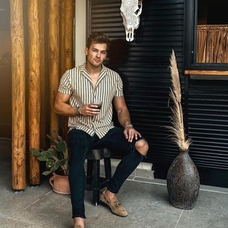 Beige Suede Loafers Outfits For Men: Dress in a white and black vertical striped short sleeve shirt and navy ripped skinny jeans if you want to look laid-back and cool without spending too much time. Beige suede loafers are the simplest way to punch up your outfit.