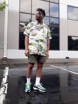 Green Athletic Shoes Outfits For Men: This relaxed pairing of a white floral short sleeve shirt and olive sports shorts is effortless, stylish and super easy to recreate. Introduce green athletic shoes to the mix et voila, your outfit is complete.