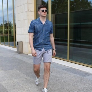 Men's Navy and White Vertical Striped Short Sleeve Shirt, Grey Sports Shorts, Grey Athletic Shoes, Black Sunglasses