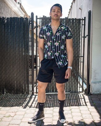 Black Leather High Top Sneakers Outfits For Men: This combo of a black floral short sleeve shirt and black sports shorts is dapper and yet it looks comfortable and apt for anything. If you're clueless about how to round off, a pair of black leather high top sneakers is a good idea.
