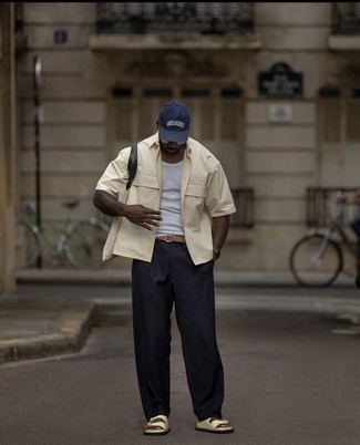 Navy Chinos Outfits: For an outfit that's super simple but can be worn in a ton of different ways, choose a beige short sleeve shirt and navy chinos. Beige leather sandals are a fail-safe way to give a touch of stylish effortlessness to your getup.