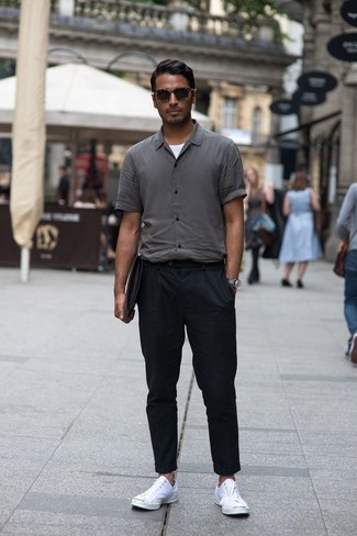 Charcoal Short Sleeve Shirt Outfits For Men: Fashionable and functional, this laid-back combo of a charcoal short sleeve shirt and black chinos provides with variety. Add white canvas low top sneakers to the equation et voila, the outfit is complete.