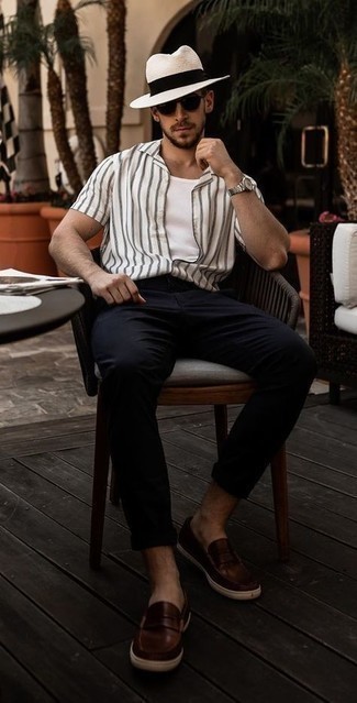 White Straw Hat Outfits For Men: For a look that's very straightforward but can be manipulated in a ton of different ways, try pairing a white and black vertical striped short sleeve shirt with a white straw hat. Introduce a pair of dark brown leather loafers to the equation to instantly change up the getup.