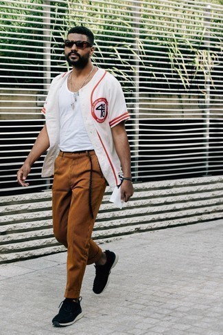Dark Brown Vertical Striped Chinos Outfits: A white and red print short sleeve shirt and dark brown vertical striped chinos are a savvy combo worth having in your casual collection. Let your styling chops truly shine by finishing off your look with a pair of black and white athletic shoes.