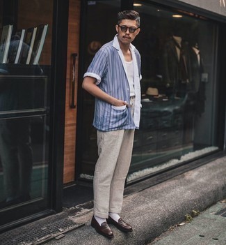 Light Blue Vertical Striped Short Sleeve Shirt Outfits For Men: This laid-back combination of a light blue vertical striped short sleeve shirt and grey linen chinos can only be described as incredibly stylish. Lift up this outfit with a pair of dark brown leather loafers.