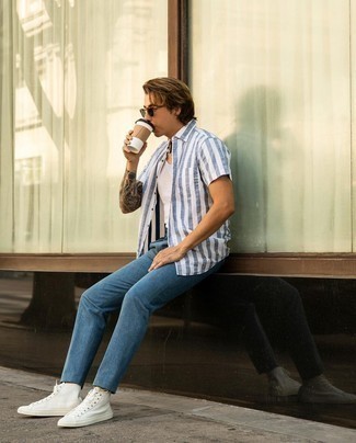 White and Blue Vertical Striped Short Sleeve Shirt Outfits For Men: The versatility of a white and blue vertical striped short sleeve shirt and blue chinos guarantees you'll have them on regular rotation. You could perhaps get a little creative when it comes to footwear and dress down your ensemble by rounding off with a pair of white canvas high top sneakers.